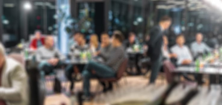 Blurred image of businesspeople at banquet business meeting event. Business and entrepreneurship events concept.