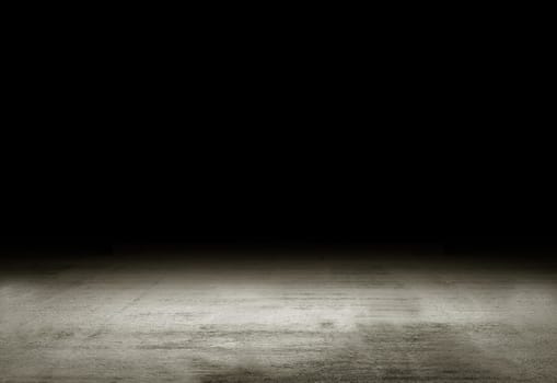 A concrete rough old grey floor with an empty space for text on top on a black background