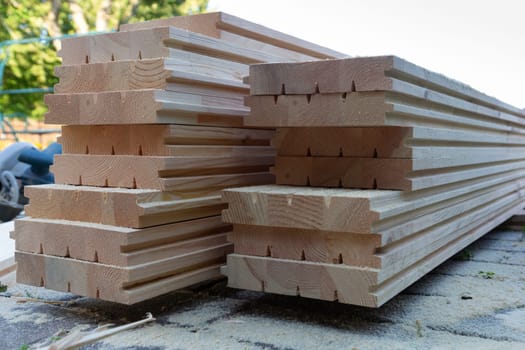 A pile of new wooden floorboards