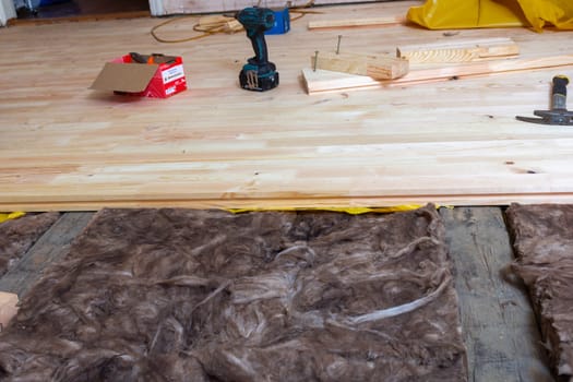 Creating a new wooden plank floor. House renovation