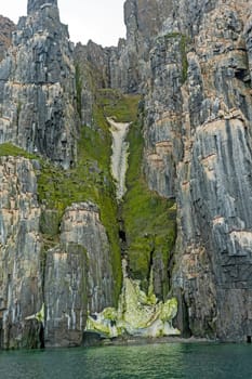 Green and Snowfilled Gulch in the Arctic in Alkefjellet in the Svalbard Islands