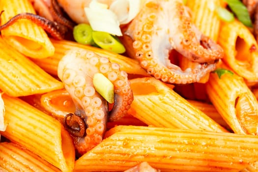 Delicious macaroni or pasta with octopus. Macaroni with seafood. American appetizer.
