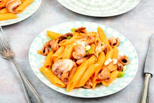 Delicious macaroni or pasta with octopus. Macaroni with seafood. American appetizer.