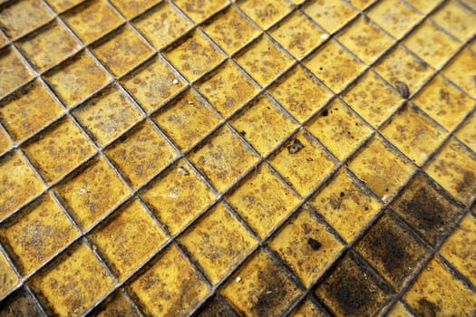Detail of a rough and rusty metal plate due to the passage of time