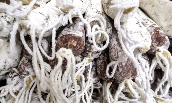 Detail of dried pork sausage in a market in the city