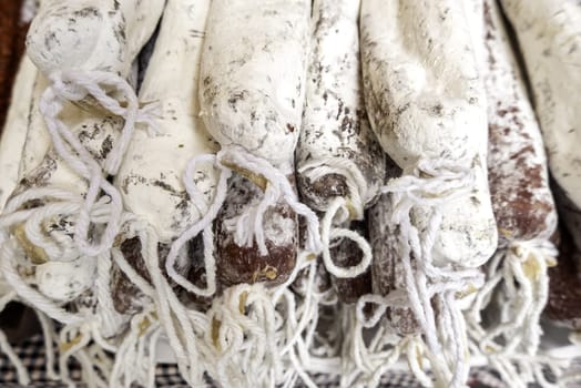 Detail of dried pork sausage in a market in the city
