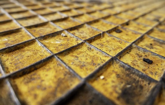 Detail of a rough and rusty metal plate due to the passage of time