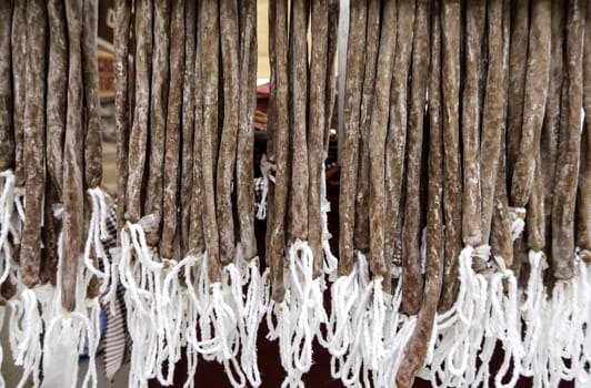 Detail of dried pork sausage in a market in the city