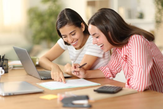 Happy workers checking document policies before sign working at home