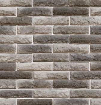 Decorative overlay stone in the form of gray brick .Texture or background.