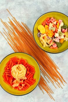 Different types and shapes of pasta, noodles and spaghetti. Top view with copy space