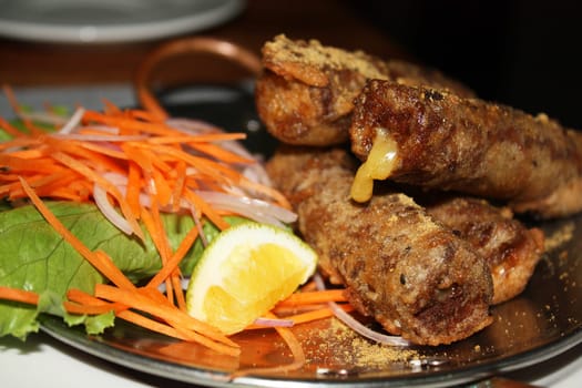 The food cooked at restaurant. Various dishes for every taste and choice.