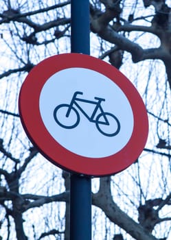 Bicycles prohibited sign. Regulation banning bikes at gardened pedestrian areas