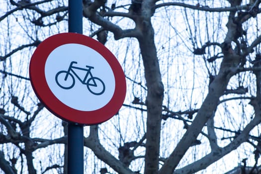 Bicycles prohibited sign. Regulation banning bikes at gardened pedestrian areas