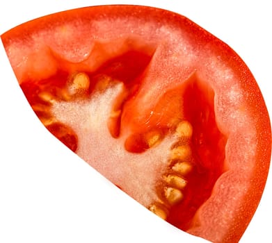 One slice of red tomato with grains in close-up on a white background