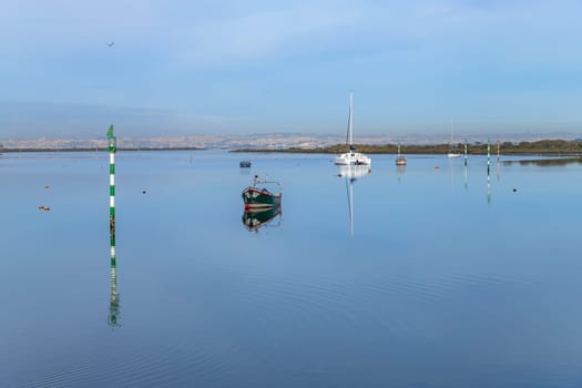 Seixal, Portugal January 6, 2024: Small, old traditional boat in Seixal, Seixal bay. Portugal.