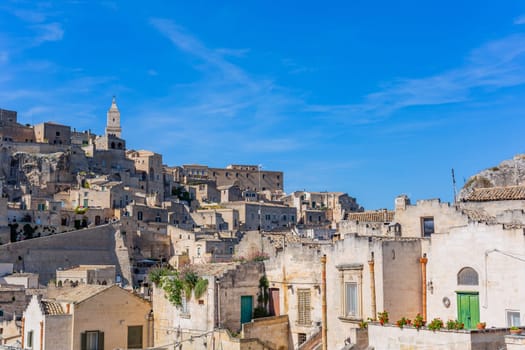 Matera, Italy - 6 May 2023: Ancient Unesco heritage old town of Matera (Sassi di Matera), Basilicata, southern Italy. Prehistoric cave dwellings