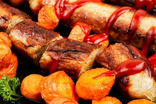 Grilled or roasted turkey meat sausages in tomato ketchup with roasted carrots. Assorted succulent fried sausages.