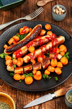 Grilled or roasted turkey meat sausages in tomato ketchup with roasted carrots. Assorted succulent fried sausages.