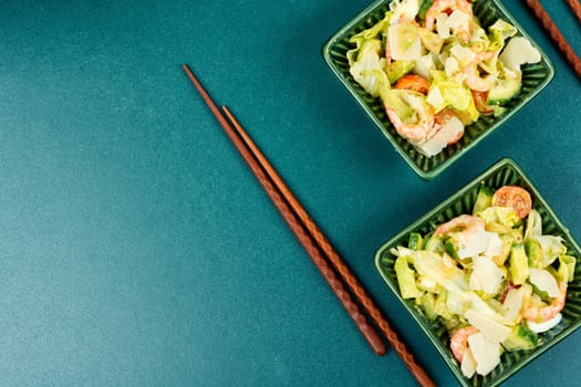 Salad with shrimp,prawns avocado and tomato in a bowl. Healthy food concept. Top view, overhead.