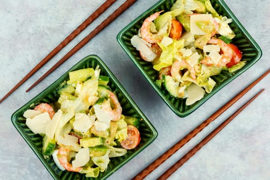 Salad with shrimp,prawns avocado and tomato in a bowl. Healthy food concept. Top view, overhead.