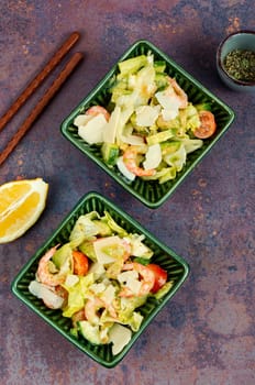 Salad with shrimp,prawns avocado and tomato in a bowl. Healthy food concept. Top view, overhead.