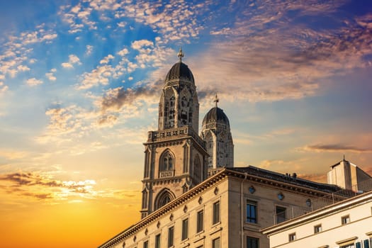 Grossm nster Romanesque-style Protestant church at sunset, Z rich, Switzerland.