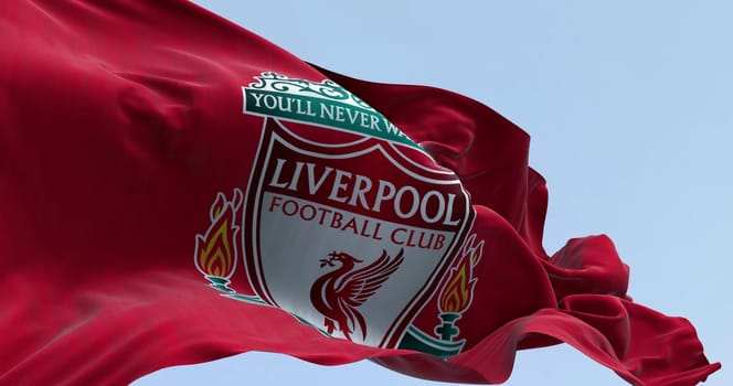 Liverpool, UK  sept. 14 2023: Close-up of Liverpool Football Club flag waving on a clear day. Illustrative editorial 3d illustration render. Fluttering fabric