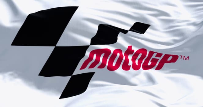 Sepang, MY, Feb. 07 2024  Close-up of MotoGP flag waving in the wind. Premier motorcycle racing competition. Illustrative editorial 3d illustration render
