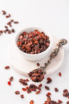 Pile of dried Berberis vulgaris, common barberry, European barberry or barberry. Edible herbal medicinal red fruit plant.