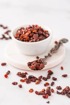 Pile of dried Berberis vulgaris, common barberry, European barberry or barberry. Edible herbal medicinal red fruit plant.