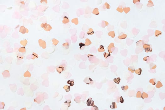Pink and golden hearts on white table top view. Romantic Wedding, Valentines, Spring or Mothers day background