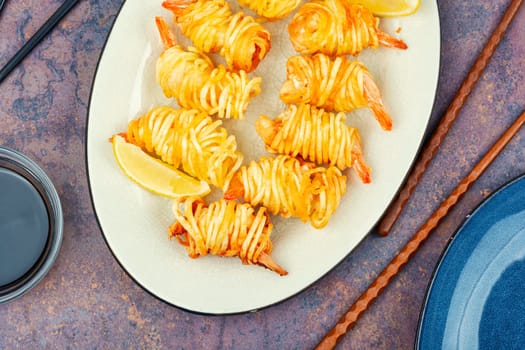 Fried rolled potato shrimps, prawns and potato rolls. Popular Asian food. Vietnamese cuisine.