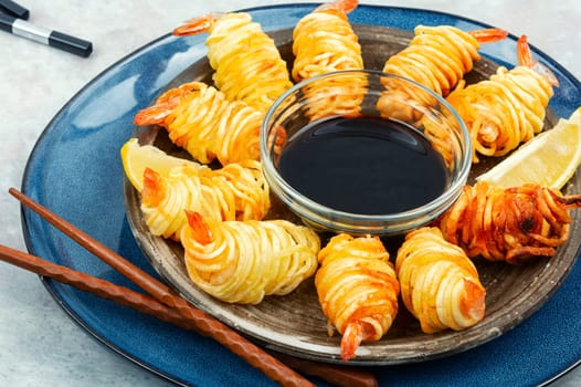 Fried rolled potato shrimps, prawns and potato rolls. Popular Asian food. Vietnamese cuisine.