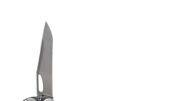 A steel multi-tool with an open knife blade lies on a white background. Pocket open folding knife. Portable multitasking multitool with many tools. EDC concept. A tool for daily practice. All in one