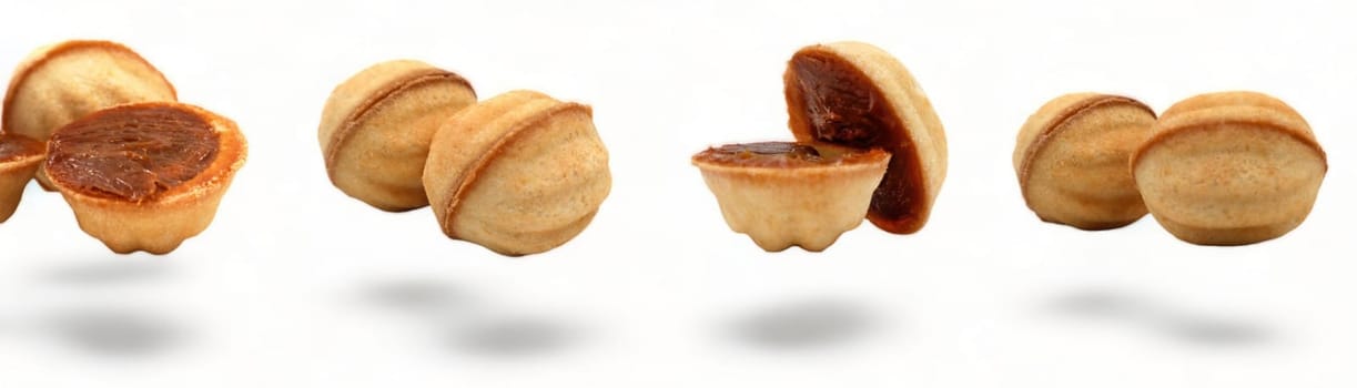 Banner with fresh and delicious cookies in the shape of a walnut with boiled condensed milk on a white background. A favorite delicacy for children and adults with a delicate filling inside