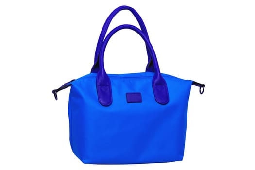 Stylish women's handbag. A fashionable female blue luxury handbag with brown leather handles isolated on white. Clipping path. Fashionable womans accessories. Advertising.
