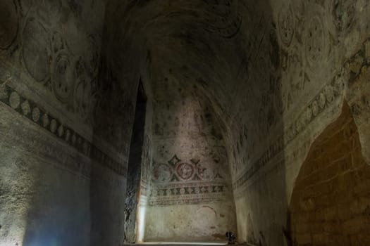 Sagaing, Myanmar - January 16th, 2019: Inside Tilawkaguru Cave Monastery, built around 1672 for meditation, one can still see old paintings.