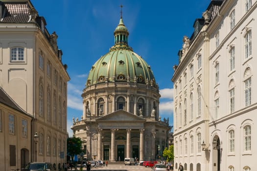 Copenhagen, Denmark - June 30th, 2015: The majestic Frederik's Church with it's impressive dome, also known as the Marble Church, forms with its rococo architecture a central point of the Frederiksstaden district.