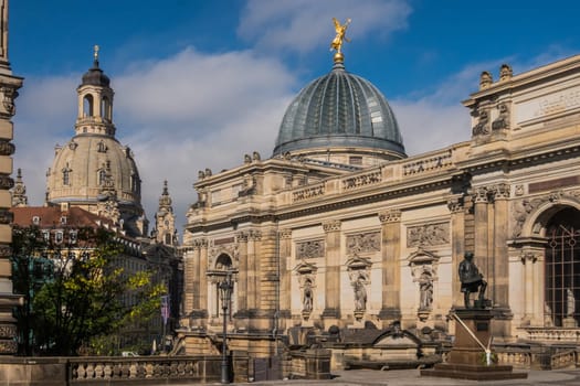 Dresden, Germany - May 21st, 2019: View to the rebuilt Dresden Frauenkirche and the Dresden Academy of Fine Arts with its glass dome