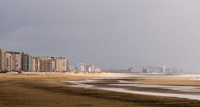 A cloudy and stormy days view over the beach of Ostend in Belgium at the North Sea