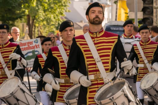 Villach, Austria - August 3th, 2019: Uniformed musicians marching at the procession of 'Villacher Kirchtag', the largest traditional folk festival in Austria.