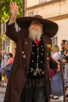 Villach, Austria - August 3th, 2019: A traditionally clothed, bearded participant at the procession of 'Villacher Kirchtag', the largest traditional folk festival in Austria.