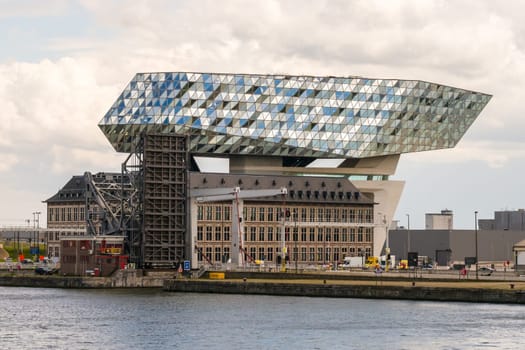 Antwerp, Belgium - June 8th, 2019: View to the unique Port House, home of the port authority's head office, at the port of Antwerp.