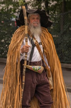 Villach, Austria - August 3th, 2019: A uniquely dressed, bearded man at the procession of 'Villacher Kirchtag', the largest traditional folk festival in Austria.