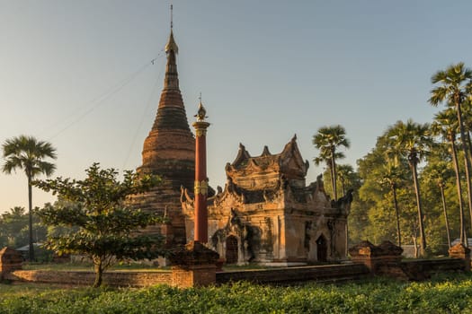 A small temple complex located in Hanthawaddy at the Inwa areal nearby Mandalay during sunset