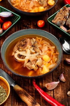 Tasty borshch, soup with meat on the table. Traditional Ukrainian Russian borscht.