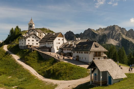 Monte Lussari, Italy - August 17th, 2019: View over the small village and the pilgrimage church of the Sanctuary of Monte Lussari at 1790 m.