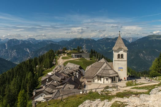 Monte Lussari, Italy - August 17th, 2019: View over the small village and the pilgrimage church of the Sanctuary of Monte Lussari at 1790 m.