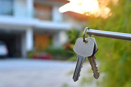 Keys in front of new house at sunny summer morning or evening. Neural network generated image. Not based on any actual person or scene.